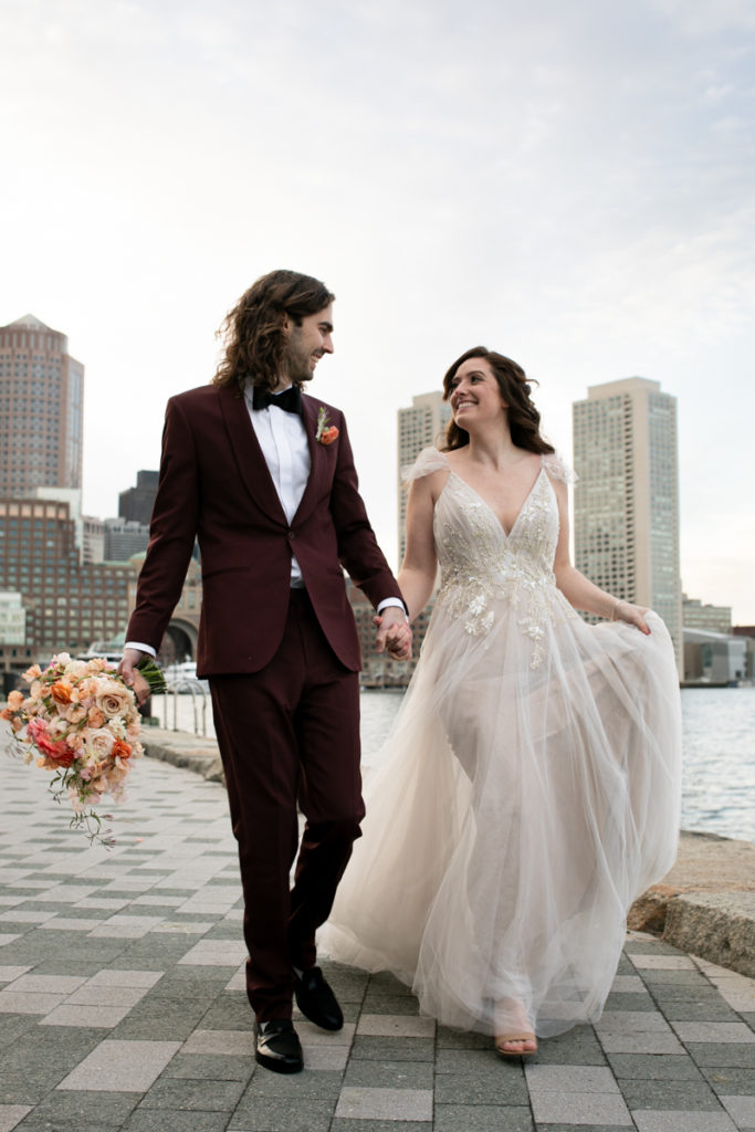 Just married Bride and Groom walk through Boston Seaport district