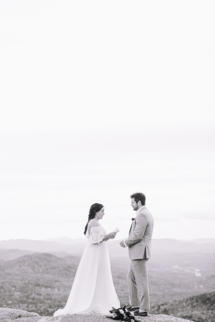 Couple share their vows on a mountain in the White Mountains in New Hampshire on their elopement day