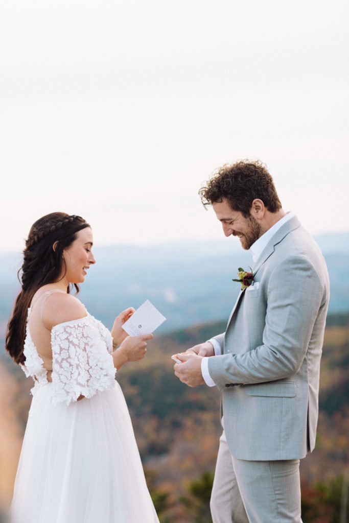 Husband and Wife share vows on top of a mountain in New England on their elopement day