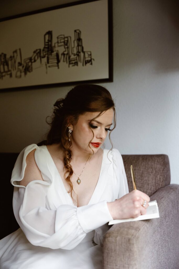 Writing personal wedding vows on their elopement day